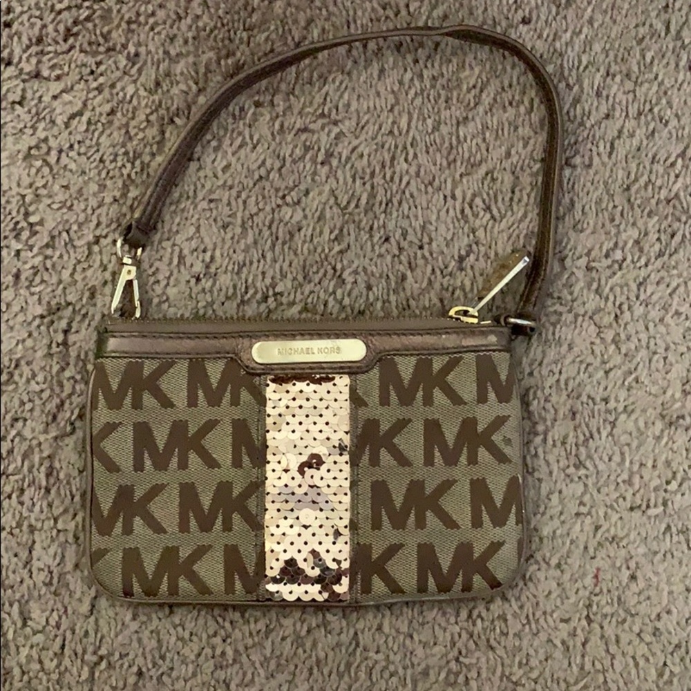 Authentic Michael Kors wristlet. Gently used.